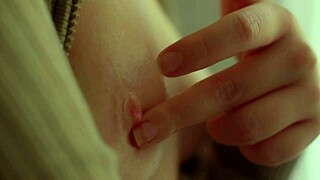 Beautiful blonde model teasing nipples and pussy. Closeup slow-motion view?