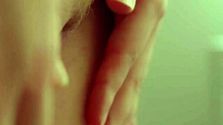 Beautiful blonde model teasing nipples and pussy. Closeup slow-motion view?