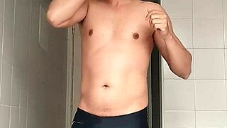 Guy in Black Beach Shorts Shaving on the Beach