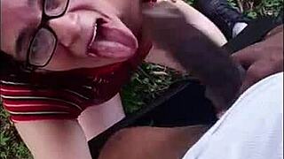 Nasty white slut eagerly sucks big black cock outdoors in interracial encounter
