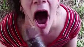 Nasty white slut eagerly sucks big black cock outdoors in interracial encounter