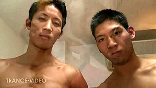 Asian hunks engage in a muscular threesome
