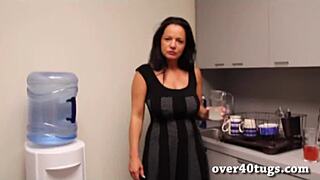 Mature woman strokes big cock in kitchen