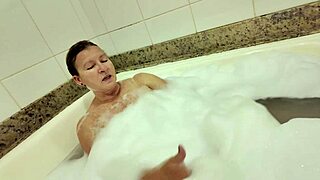 Massaging mature milf hard in hot tub