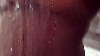Amateur babe soaps big boobs and fingers wet pussy in steamy shower play