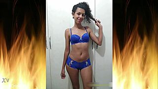 Feel the tease as beautiful brunette slips into blue lingerie for intimate reveal