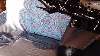 total black latex outfit hides her petite milf curves under fishnets pantyhose and knee boots