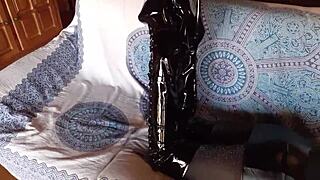 total black latex outfit hides her petite milf curves under fishnets pantyhose and knee boots