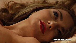 the bound lesbian slave gets whipped hard by her madame who licks to intense orgasm.