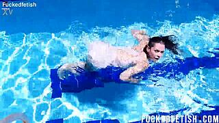 yessica bunny's shaved pussy glistens wet underwater with small tits bouncing