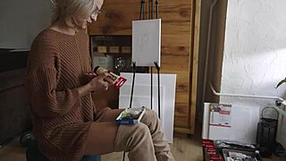 hey check out this cute blonde painting her pretty pussy flower