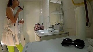 hot college brunette in mini skirt and knee socks flashes panties in bathroom