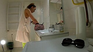 hot college brunette in mini skirt and knee socks flashes panties in bathroom