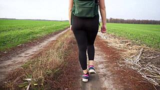 milf's black tights tease hints at her swaying curves during yoga stroll