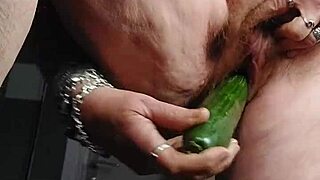 Grandma stuffs hairy pussy with thick cucumber