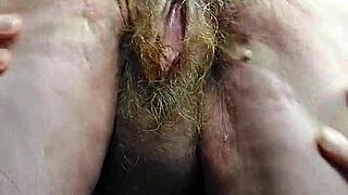 Grandma stuffs hairy pussy with thick cucumber