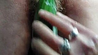 Grandma stuffs hairy pussy with thick cucumber