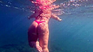 the curvy pawg teen glides underwater in thong bikini flaunting big ass curves