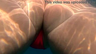 the curvy pawg teen glides underwater in thong bikini flaunting big ass curves