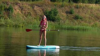 sup girl flashing pink micro bikini outdoors