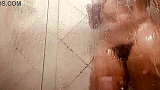shower babe flashes her huge hairy pussy lips for the camera!