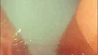 Pretty blonde babe masturbates in hot tub then takes loud cumshot