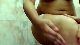 desi girlfriend fingers big tits in bathroom?
