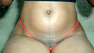 Ebony Babe Exposes Pussy While Teasing Tits