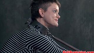 restrained sub screams as master spanks with cat o' nine tails!