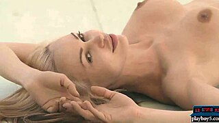 suggestive blonde milf model peels off clothes flashing perky shaved pussy