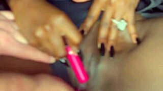 Damn, sexy black model vibes vibrator deep in shaved pussy for her man!