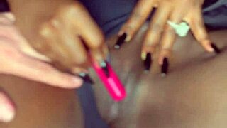 Damn, sexy black model vibes vibrator deep in shaved pussy for her man!