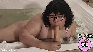 trans cutie relaxes playfully in bubbling hydromassage tub