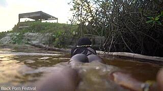 skinny african beauty teases her perky tits splashing in the water