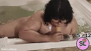 trans cutie relaxes playfully in bubbling hydromassage tub