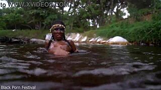 skinny african beauty teases her perky tits splashing in the water