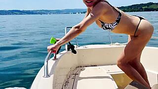 cute blonde housewife washes boat in sexy thong bikini