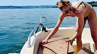cute blonde housewife washes boat in sexy thong bikini
