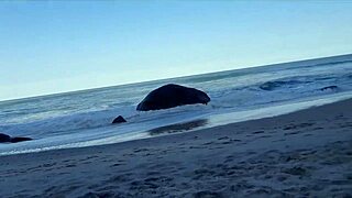 latina milf licks huge clit on beach while brunette sucks monster cock relaxing