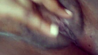 chubby black babe spreads shaved pussy lips closeup for first solo fingering