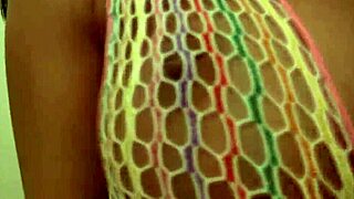 Kate wears net dress while masturbating her wet pussy