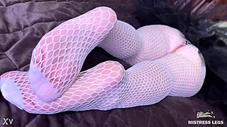 goddess teases feet in fishnets on bed driving lovers crazy