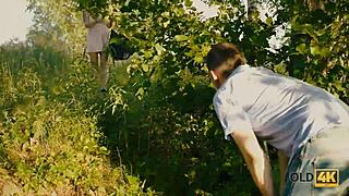 old man seduces busty tattooed teen for forest pussy licking fun