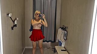 She tries on see-through transparent clothes in the shopping mall changing room for public fetish eyes