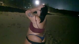 Big ass slut shakes curves and flashes pierced nipples on beach