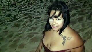 Big ass slut shakes curves and flashes pierced nipples on beach