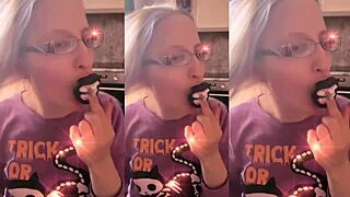Blonde with glasses brushes long hair using lollipop in asmr