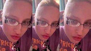 Blonde with glasses brushes long hair using lollipop in asmr