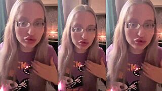 Blonde with glasses brushes long hair using lollipop in asmr