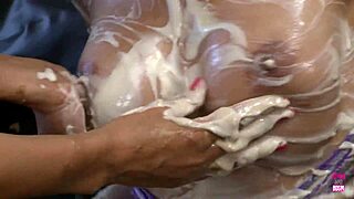 Picture two busty brunettes smearing food over tits and asses while kissing passionately